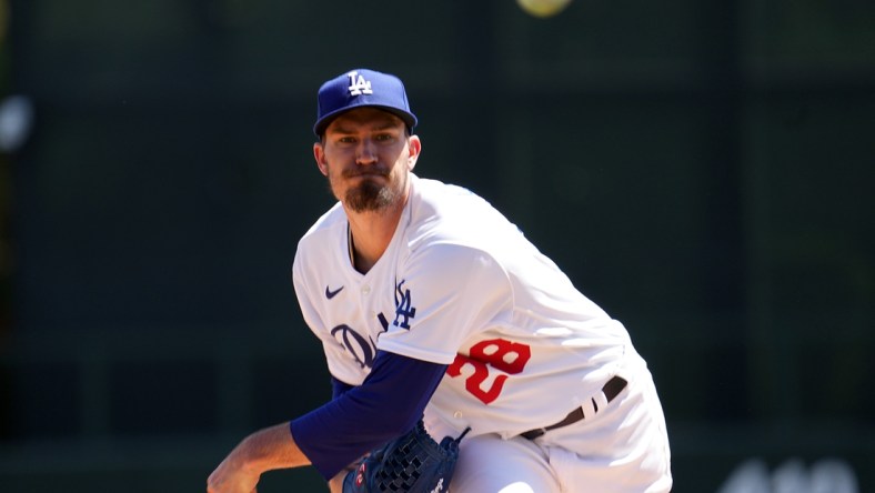 Mar 27, 2022; Phoenix, Arizona, USA; Los Angeles Dodgers starting pitcher Andrew Heaney (28) pitches against the Chicago White Sox during the first inning of a spring training game at Camelback Ranch-Glendale. Mandatory Credit: Joe Camporeale-USA TODAY Sports