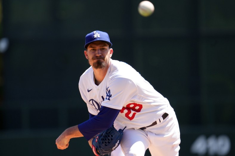 Mar 27, 2022; Phoenix, Arizona, USA; Los Angeles Dodgers starting pitcher Andrew Heaney (28) pitches against the Chicago White Sox during the first inning of a spring training game at Camelback Ranch-Glendale. Mandatory Credit: Joe Camporeale-USA TODAY Sports