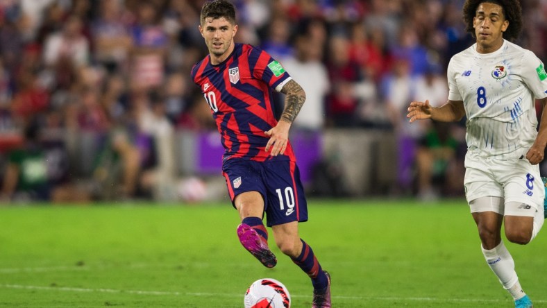 Mar 27, 2022; Orlando, Florida, USA; United States forward Christian Pulisic (10) passes the ball against Panama in the second half during a FIFA World Cup Qualifier soccer match at Exploria Stadium. Mandatory Credit: Jeremy Reper-USA TODAY Sports