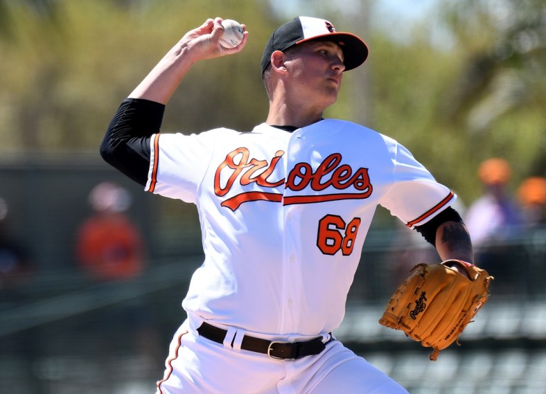 Mar 21, 2022; Sarasota, Florida, USA; Baltimore Orioles pitcher Tyler Wells (68) throws a pitch in the first inning of the game against the Minnesota Twins during spring training at Ed Smith Stadium. Mandatory Credit: Jonathan Dyer-USA TODAY Sports