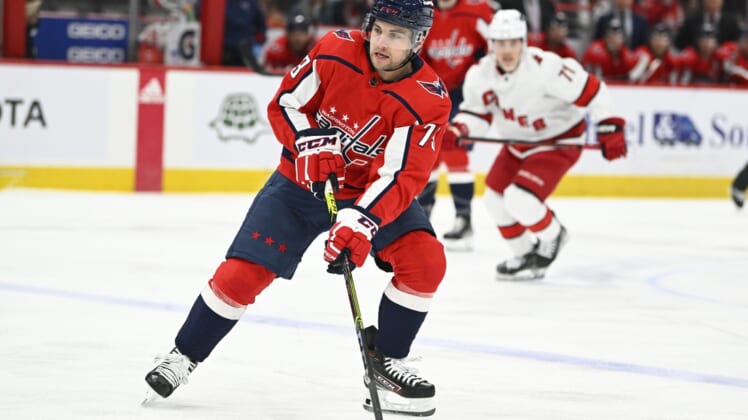 Mar 28, 2022; Washington, District of Columbia, USA; Washington Capitals left wing Conor Sheary (73) handles the puck against the Carolina Hurricanes during the first period at Capital One Arena. Mandatory Credit: Brad Mills-USA TODAY Sports