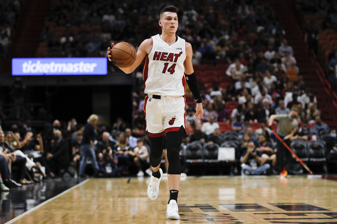 Mar 28, 2022; Miami, Florida, USA; Miami Heat guard Tyler Herro (14) dribbles the basketball during the second quarter against the Sacramento Kings at FTX Arena. Mandatory Credit: Sam Navarro-USA TODAY Sports