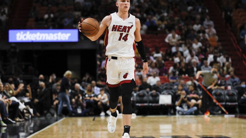 Mar 28, 2022; Miami, Florida, USA; Miami Heat guard Tyler Herro (14) dribbles the basketball during the second quarter against the Sacramento Kings at FTX Arena. Mandatory Credit: Sam Navarro-USA TODAY Sports