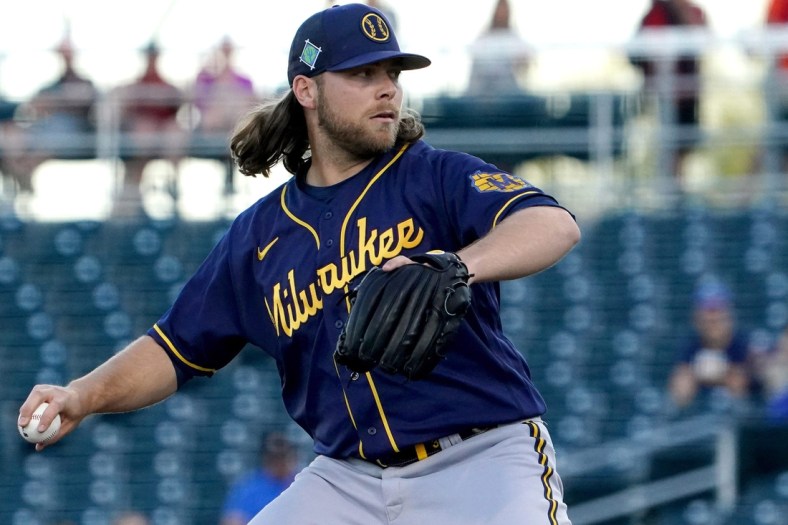 Corbin Burnes delivers a pitch during a Brewers spring training game against the Cincinnati Reds, Wednesday, March 23, 2022, at Goodyear Ballpark in Goodyear, Ariz.

Syndication The Enquirer