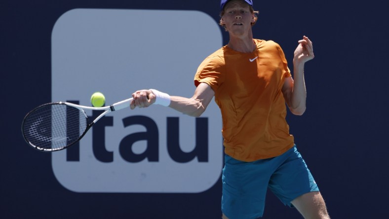 Mar 29, 2022; Miami Gardens, FL, USA; Jannik Sinner (ITA) hits a forehand against Nick Kyrgios (AUS)(not pictured) in a fourth round men's singles match in the Miami Open at Hard Rock Stadium. Mandatory Credit: Geoff Burke-USA TODAY Sports