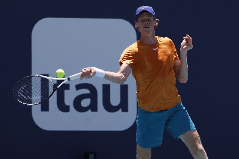 Mar 29, 2022; Miami Gardens, FL, USA; Jannik Sinner (ITA) hits a forehand against Nick Kyrgios (AUS)(not pictured) in a fourth round men's singles match in the Miami Open at Hard Rock Stadium. Mandatory Credit: Geoff Burke-USA TODAY Sports