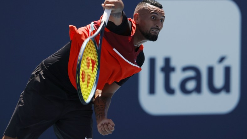 Mar 29, 2022; Miami Gardens, FL, USA; Nick Kyrgios (AUS) serves against Jannik Sinner (ITA)(not pictured) in a fourth round men's singles match in the Miami Open at Hard Rock Stadium. Mandatory Credit: Geoff Burke-USA TODAY Sports