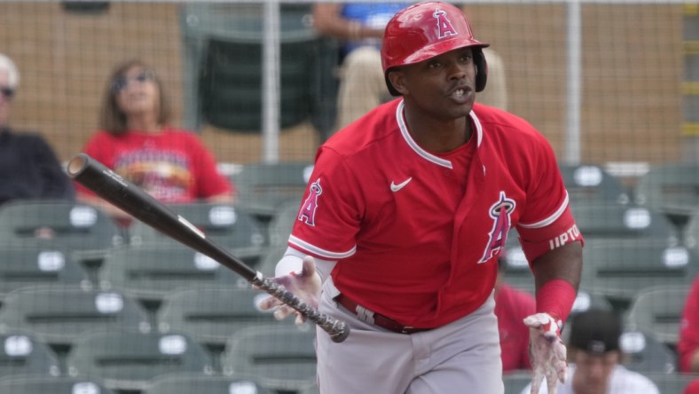 Mar 29, 2022; Salt River Pima-Maricopa, Arizona, USA; Los Angeles Angels left fielder Justin Upton (10) hits against the Colorado Rockies during a spring training game at Salt River Fields at Talking Stick. Mandatory Credit: Rick Scuteri-USA TODAY Sports