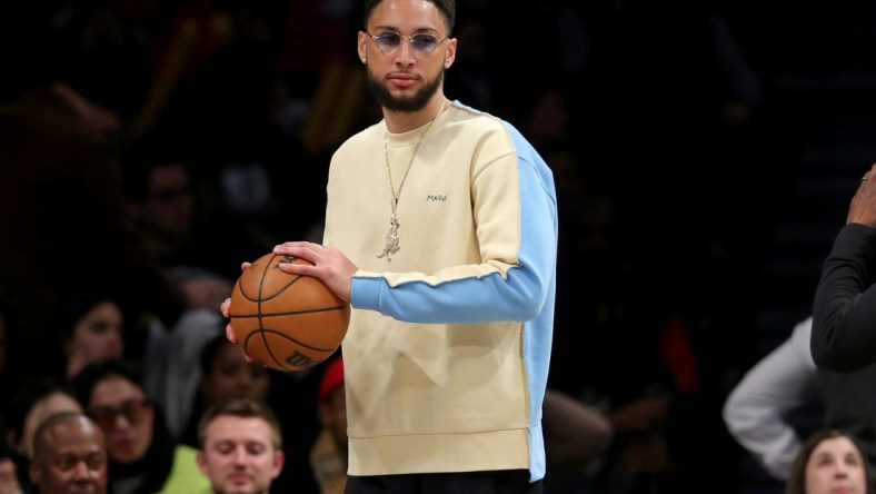 Mar 29, 2022; Brooklyn, New York, USA; Brooklyn Nets injured guard Ben Simmons (10) holds a basketball during a timeout during the fourth quarter against the Detroit Pistons at Barclays Center. The Nets defeated the Pistons 130-123. Mandatory Credit: Brad Penner-USA TODAY Sports