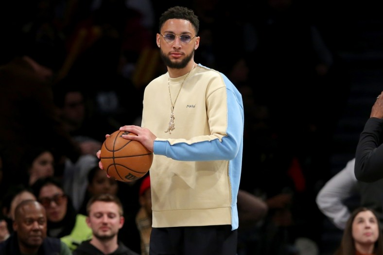 Mar 29, 2022; Brooklyn, New York, USA; Brooklyn Nets injured guard Ben Simmons (10) holds a basketball during a timeout during the fourth quarter against the Detroit Pistons at Barclays Center. The Nets defeated the Pistons 130-123. Mandatory Credit: Brad Penner-USA TODAY Sports