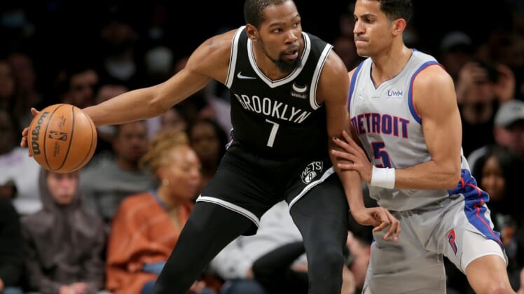 Mar 29, 2022; Brooklyn, New York, USA; Brooklyn Nets forward Kevin Durant (7) controls the ball against Detroit Pistons guard Frank Jackson (5) during the second quarter at Barclays Center. Mandatory Credit: Brad Penner-USA TODAY Sports