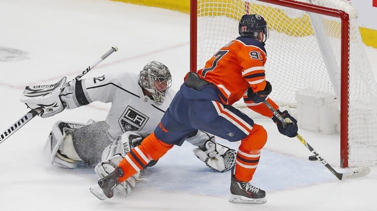 Mar 30, 2022; Edmonton, Alberta, CAN; Edmonton Oilers forward Connor McDavid (97) scores a shootout goal on Los Angeles Kings goaltender Jonathan Quick (32) at Rogers Place. Mandatory Credit: Perry Nelson-USA TODAY Sports
