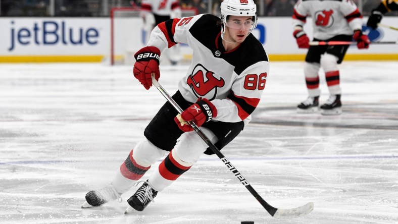 Mar 31, 2022; Boston, Massachusetts, USA; New Jersey Devils center Jack Hughes (86) skates with the puck during the second period of a game against the Boston Bruins at the TD Garden. Mandatory Credit: Brian Fluharty-USA TODAY Sports