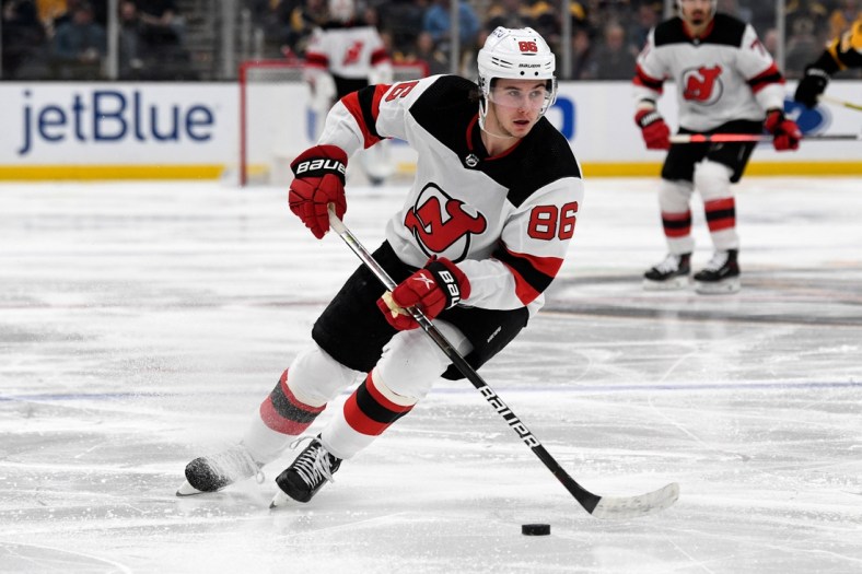 Mar 31, 2022; Boston, Massachusetts, USA; New Jersey Devils center Jack Hughes (86) skates with the puck during the second period of a game against the Boston Bruins at the TD Garden. Mandatory Credit: Brian Fluharty-USA TODAY Sports