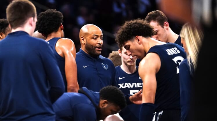 Mar 31, 2022; New York, New York, USA; Xavier Musketeers interim head coach Jonas Hayes speaks to his players at a break during the first half of the NIT college basketball finals against the Texas A&M Aggies at Madison Square Garden. Mandatory Credit: Gregory Fisher-USA TODAY Sports
