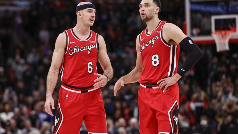 Mar 31, 2022; Chicago, Illinois, USA; Chicago Bulls guard Alex Caruso (6) talks with guard Zach LaVine (8) during overtime of an NBA game against the LA Clippers at United Center. Mandatory Credit: Kamil Krzaczynski-USA TODAY Sports