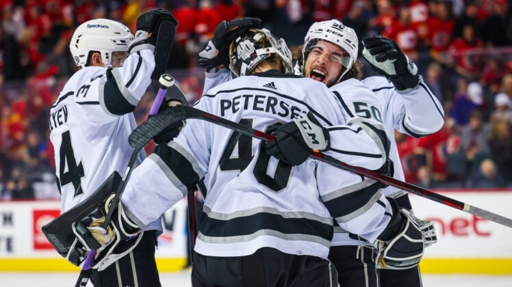 Mar 31, 2022; Calgary, Alberta, CAN; Los Angeles Kings goaltender Cal Petersen (40) celebrate win with teammates against the Calgary Flames at Scotiabank Saddledome. Mandatory Credit: Sergei Belski-USA TODAY Sports