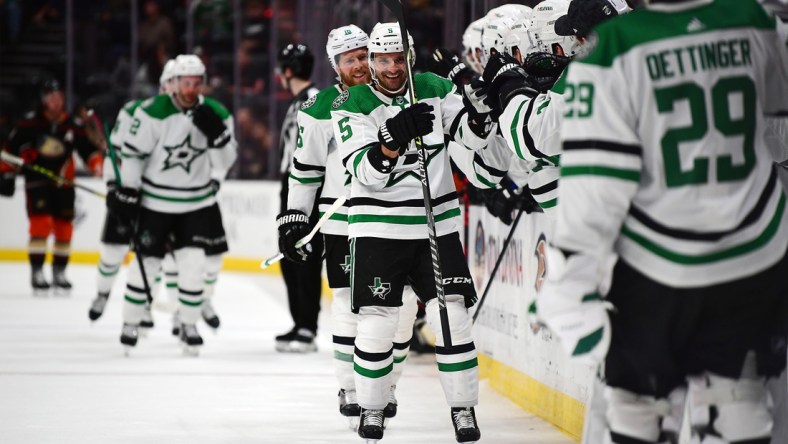 Mar 31, 2022; Anaheim, California, USA; Dallas Stars defenseman Andrej Sekera (5) celebrates his goal scored against the Anaheim Ducks during the third period at Honda Center. Mandatory Credit: Gary A. Vasquez-USA TODAY Sports