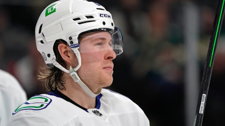 Mar 24, 2022; Saint Paul, Minnesota, USA; Vancouver Canucks right wing Brock Boeser (6) takes a breather during a TV timeout against the Minnesota Wild at Xcel Energy Center. Mandatory Credit: Nick Wosika-USA TODAY Sports