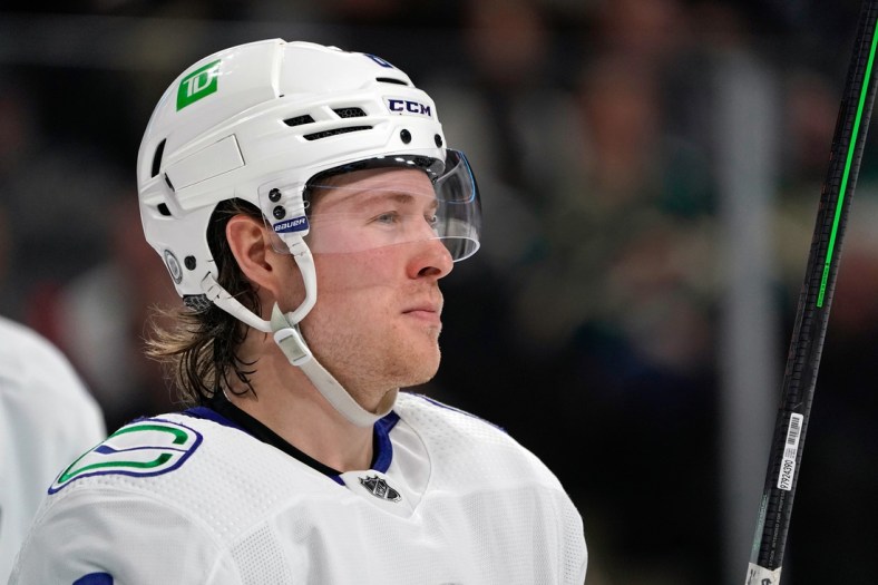 Mar 24, 2022; Saint Paul, Minnesota, USA; Vancouver Canucks right wing Brock Boeser (6) takes a breather during a TV timeout against the Minnesota Wild at Xcel Energy Center. Mandatory Credit: Nick Wosika-USA TODAY Sports