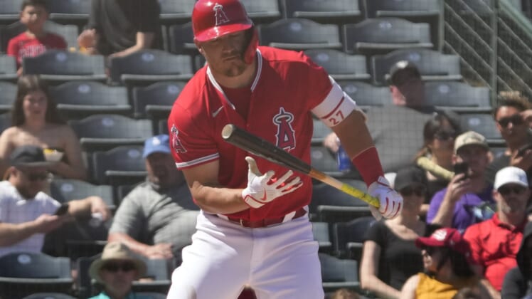 Apr 1, 2022; Tempe, Arizona, USA; Los Angeles Angels center fielder Mike Trout (27) reacts after missing a pitch against the Cincinnati Reds during a spring training game at Tempe Diablo Stadium. Mandatory Credit: Rick Scuteri-USA TODAY Sports