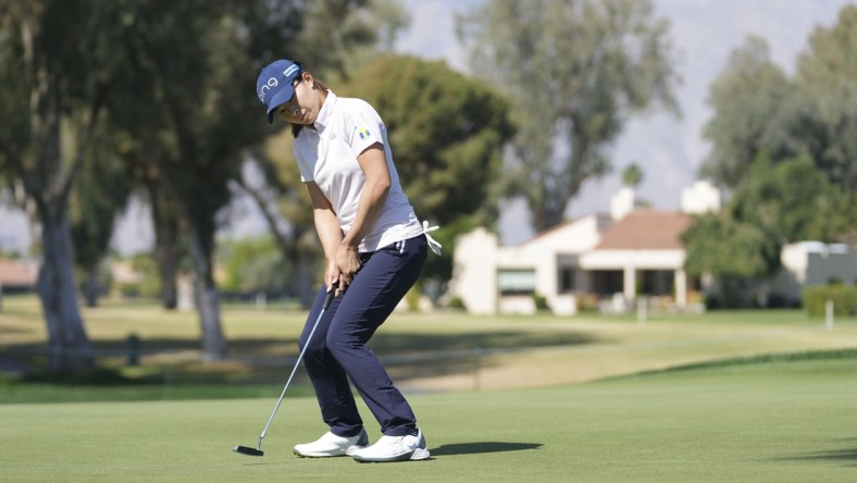 Apr 1, 2022; Rancho Mirage, California, USA; Hinako Shibuno encourages a birdie putt to fall during the second round of the Chevron Championship golf tournament. Mandatory Credit: David Yeazell-USA TODAY Sports