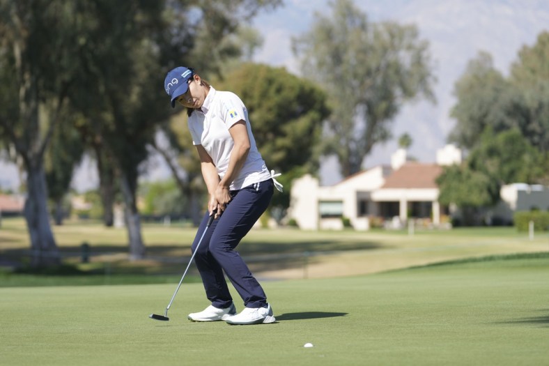 Apr 1, 2022; Rancho Mirage, California, USA; Hinako Shibuno encourages a birdie putt to fall during the second round of the Chevron Championship golf tournament. Mandatory Credit: David Yeazell-USA TODAY Sports