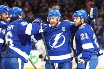 Apr 1, 2022; Tampa, Florida, USA;Tampa Bay Lightning center Steven Stamkos (91) is congratulated by defenseman Victor Hedman (77), center Brayden Point (21), left wing Pierre-Edouard Bellemare (41) and right wing Nikita Kucherov (86) after a goal during the first period against the Chicago Blackhawks at Amalie Arena. Mandatory Credit: Kim Klement-USA TODAY Sports
