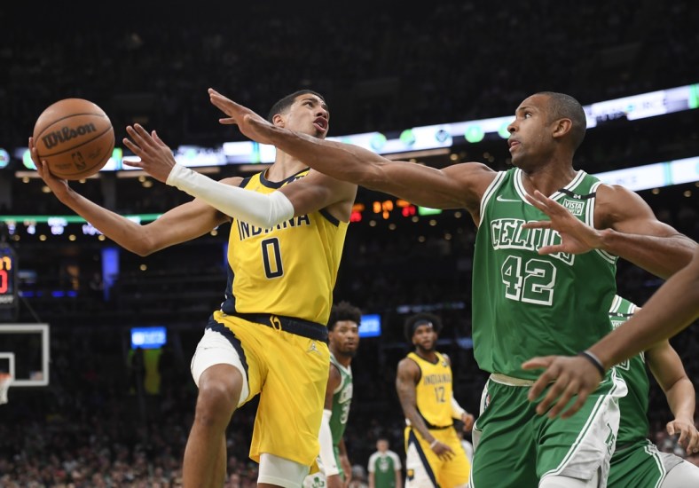 Apr 1, 2022; Boston, Massachusetts, USA; Indiana Pacers guard Tyrese Haliburton (0) shoots the ball while Boston Celtics center Al Horford (42) defends during the first half at TD Garden. Mandatory Credit: Bob DeChiara-USA TODAY Sports