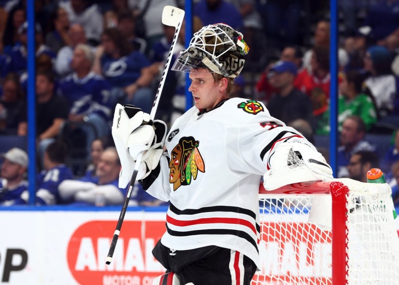 Apr 1, 2022; Tampa, Florida, USA; Chicago Blackhawks goaltender Kevin Lankinen (32) looks on against the Tampa Bay Lightning during the first period at Amalie Arena. Mandatory Credit: Kim Klement-USA TODAY Sports