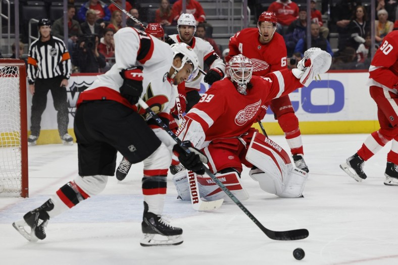 Apr 1, 2022; Detroit, Michigan, USA;  Ottawa Senators right wing Mathieu Joseph (21) moves in for a shot against Detroit Red Wings goaltender Alex Nedeljkovic (39) in the first period at Little Caesars Arena. Mandatory Credit: Rick Osentoski-USA TODAY Sports