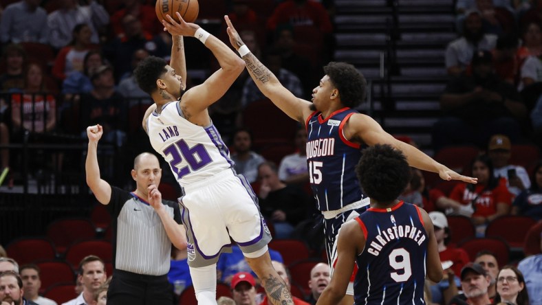 Apr 1, 2022; Houston, Texas, USA; Sacramento Kings guard Jeremy Lamb (26) shoots the ball as Houston Rockets guard Daishen Nix (15) defends during the second quarter at Toyota Center. Mandatory Credit: Troy Taormina-USA TODAY Sports