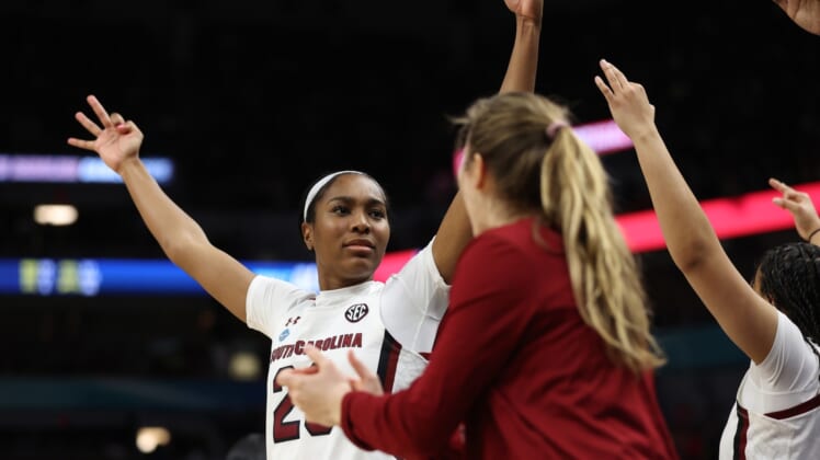 Apr 1, 2022; Minneapolis, MN, USA; South Carolina Gamecocks guard Bree Hall (23) celebrates with teammates on the bench in the second half against the Louisville Cardinals in the Final Four semifinals of the women's college basketball NCAA Tournament at Target Center. Mandatory Credit: Matt Krohn-USA TODAY Sports