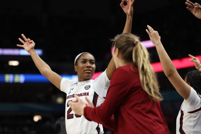 Apr 1, 2022; Minneapolis, MN, USA; South Carolina Gamecocks guard Bree Hall (23) celebrates with teammates on the bench in the second half against the Louisville Cardinals in the Final Four semifinals of the women's college basketball NCAA Tournament at Target Center. Mandatory Credit: Matt Krohn-USA TODAY Sports