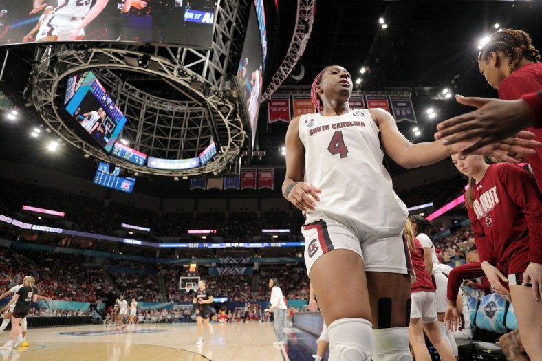 Apr 1, 2022; Minneapolis, MN, USA; South Carolina Gamecocks forward Aliyah Boston (4) celebrates with teammates on the bench against the Louisville Cardinals during the second half in the Final Four semifinals of the women's college basketball NCAA Tournament at Target Center. Mandatory Credit: Matt Krohn-USA TODAY Sports