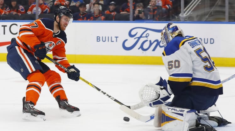 Apr 1, 2022; Edmonton, Alberta, CAN; St. Louis Blues goaltender Jordan Binnington (50) makes a save on a break-away by Edmonton Oilers forward Connor McDavid (97) during the first period at Rogers Place. Mandatory Credit: Perry Nelson-USA TODAY Sports