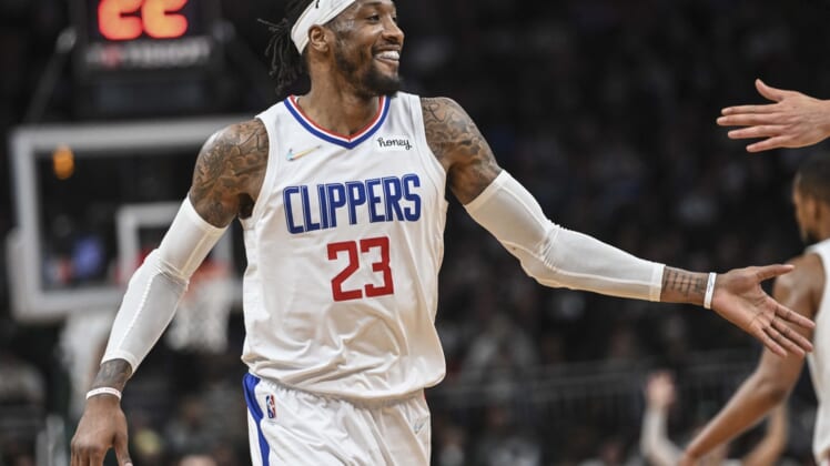 Apr 1, 2022; Milwaukee, Wisconsin, USA; LA Clippers forward Robert Covington (23) reacts after scoring a 3-point basket in the fourth quarter against the Milwaukee Bucks at Fiserv Forum. Mandatory Credit: Benny Sieu-USA TODAY Sports