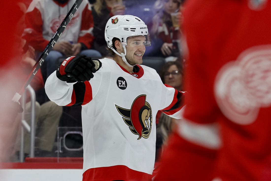 Apr 1, 2022; Detroit, Michigan, USA;  Ottawa Senators center Josh Norris (9) celebrates his goal in the third period against the Detroit Red Wings at Little Caesars Arena. Mandatory Credit: Rick Osentoski-USA TODAY Sports