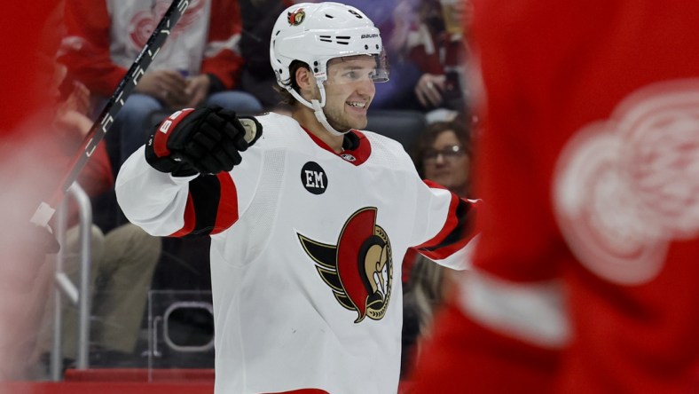 Apr 1, 2022; Detroit, Michigan, USA;  Ottawa Senators center Josh Norris (9) celebrates his goal in the third period against the Detroit Red Wings at Little Caesars Arena. Mandatory Credit: Rick Osentoski-USA TODAY Sports