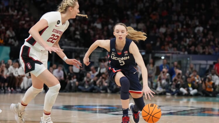 Apr 1, 2022; Minneapolis, MN, USA; UConn Huskies guard Paige Bueckers (5) dribbles the ball as Stanford Cardinal forward Cameron Brink (22) during the first half in the Final Four semifinals of the women's college basketball NCAA Tournament at Target Center. Mandatory Credit: Kirby Lee-USA TODAY Sports