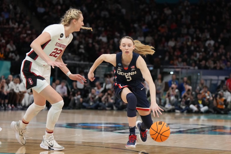 Apr 1, 2022; Minneapolis, MN, USA; UConn Huskies guard Paige Bueckers (5) dribbles the ball as Stanford Cardinal forward Cameron Brink (22) during the first half in the Final Four semifinals of the women's college basketball NCAA Tournament at Target Center. Mandatory Credit: Kirby Lee-USA TODAY Sports