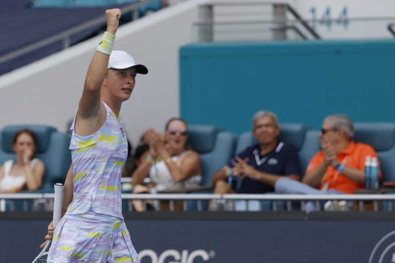 Apr 2, 2022; Miami Gardens, FL, USA;  Iga Swiatek (POL) reacts after a breaking serve against Naomi Osaka (JPN)(not pictured) in the women's singles final in the Miami Open at Hard Rock Stadium. Mandatory Credit: Geoff Burke-USA TODAY Sports