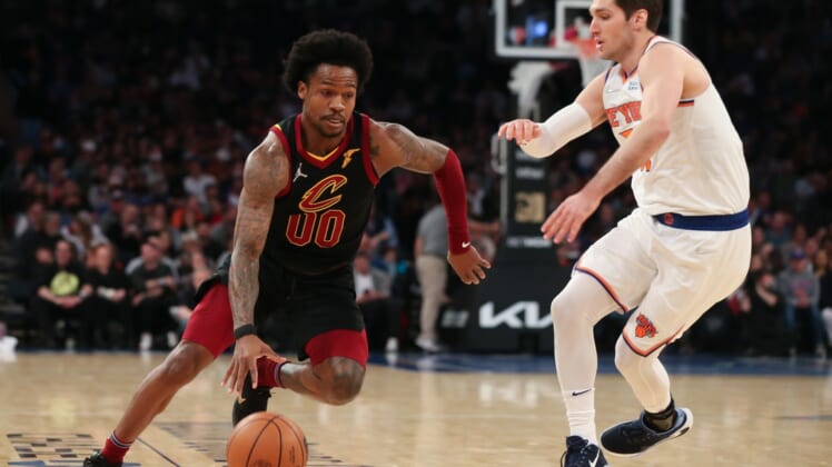 Apr 2, 2022; New York, New York, USA; Cleveland Cavaliers guard Brandon Goodwin (00) dribbles the ball past New York Knicks guard Ryan Arcidiacono (51) during the second quarter at Madison Square Garden. Mandatory Credit: Tom Horak-USA TODAY Sports