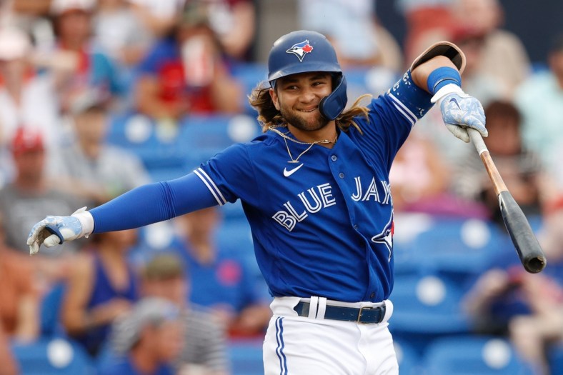 Apr 2, 2022; Dunedin, Florida, USA; Toronto Blue Jays shortstop Bo Bichette (11) reacts to a foul ball in the fourth inning against the Philadelphia Phillies during spring training at TD Ballpark. Mandatory Credit: Nathan Ray Seebeck-USA TODAY Sports