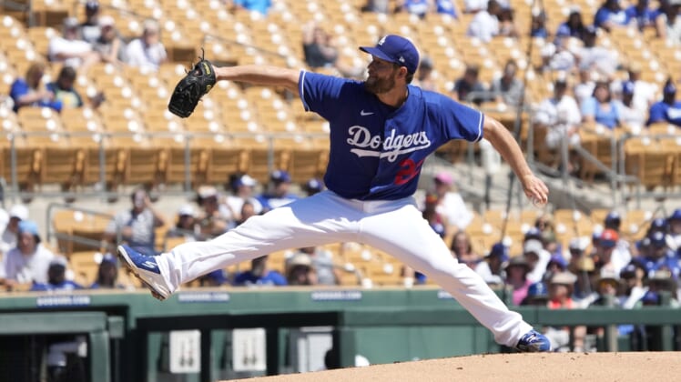 Apr 2, 2022; Phoenix, Arizona, USA; Los Angeles Dodgers starting pitcher Clayton Kershaw (22) throws against the San Francisco Giants during a spring training game at Camelback Ranch-Glendale. Mandatory Credit: Rick Scuteri-USA TODAY Sports