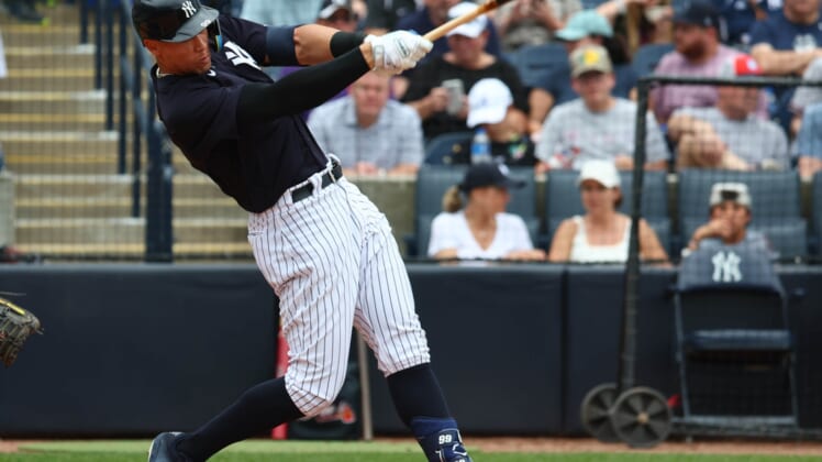 Apr 2, 2022; Tampa, Florida, USA; New York Yankees right fielder Aaron Judge (99) singles during the fourth inning against the Atlanta Braves during spring training at George M. Steinbrenner Field. Mandatory Credit: Kim Klement-USA TODAY Sports