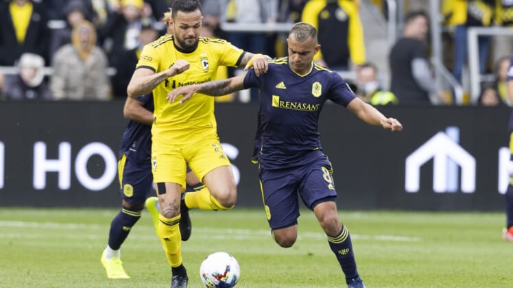 Apr 2, 2022; Columbus, Ohio, USA; Columbus Crew midfielder Artur (8) and Nashville SC midfielder Randall Leal (8) battle for the ball in the first half at Lower.com Field. Mandatory Credit: Greg Bartram-USA TODAY Sports