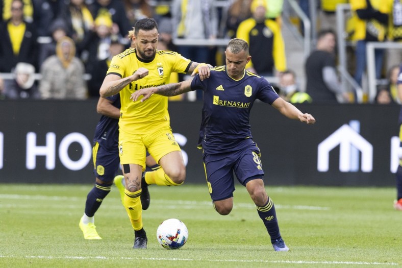 Apr 2, 2022; Columbus, Ohio, USA; Columbus Crew midfielder Artur (8) and Nashville SC midfielder Randall Leal (8) battle for the ball in the first half at Lower.com Field. Mandatory Credit: Greg Bartram-USA TODAY Sports