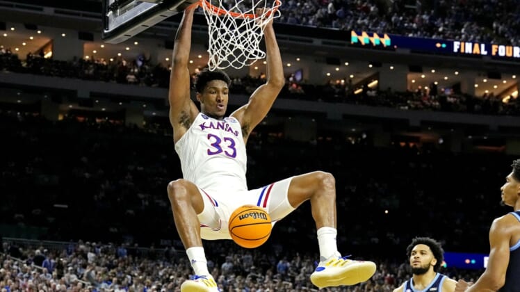 Apr 2, 2022; New Orleans, LA, USA; Kansas Jayhawks forward David McCormack (33) dunks the ball against dunks the ball against Villanova Wildcats forward Brandon Slater (3) during the second half in the 2022 NCAA men's basketball tournament Final Four semifinals at Caesars Superdome. Mandatory Credit: Robert Deutsch-USA TODAY Sports