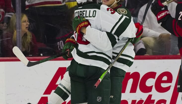 Apr 2, 2022; Raleigh, North Carolina, USA;  Minnesota Wild left wing Kirill Kaprizov (97) is congratulated after his goal by right wing Mats Zuccarello (36) against the Carolina Hurricanes during the third period at PNC Arena. Mandatory Credit: James Guillory-USA TODAY Sports